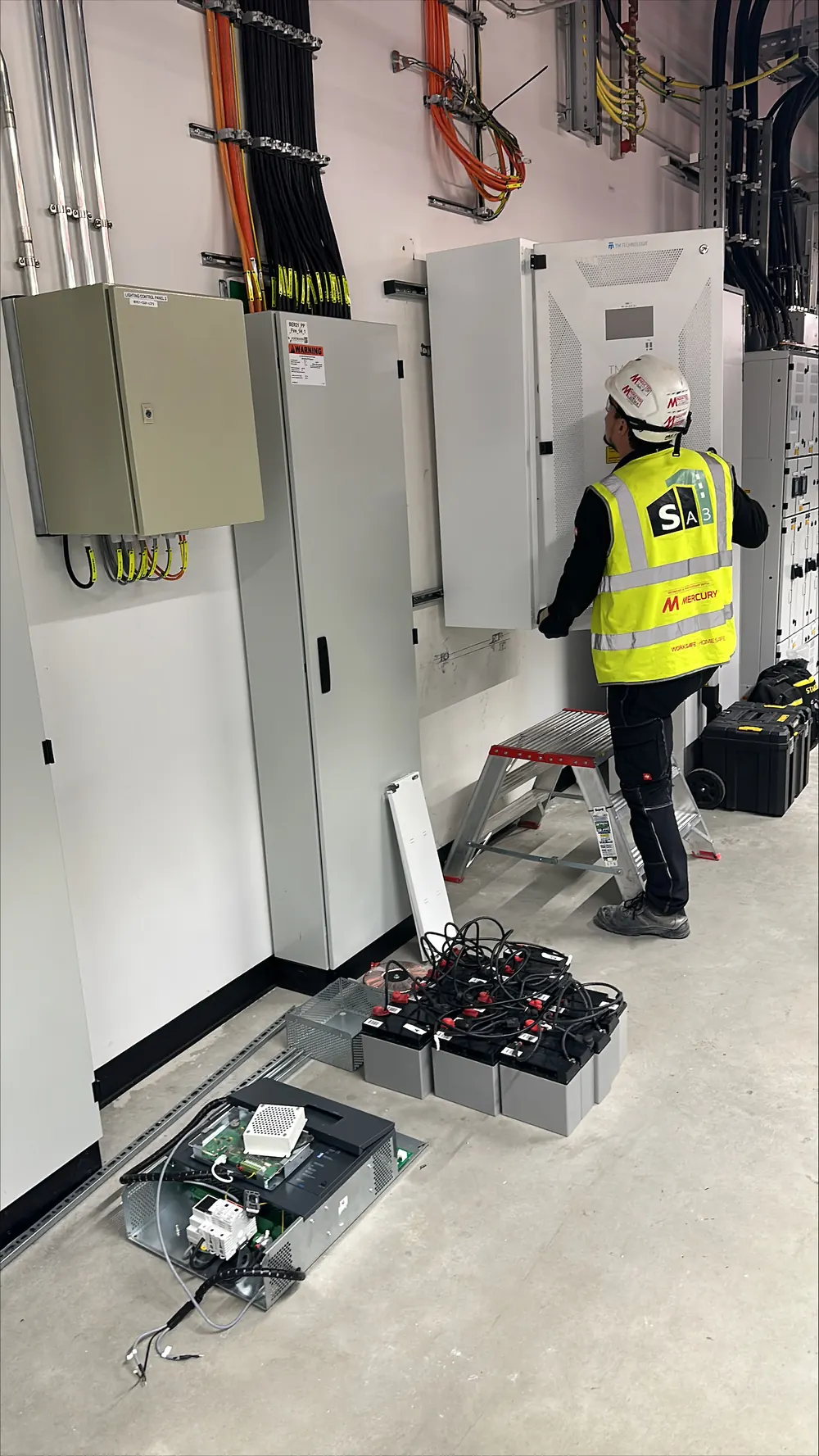 SA3 Power engineer commissioning energy-efficient UPS equipment in a data centre