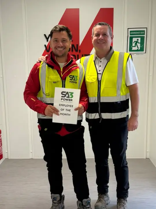 Marian Chelea receiving his SA3 Power Employee of the Month award from Project Manager Alan Fullam