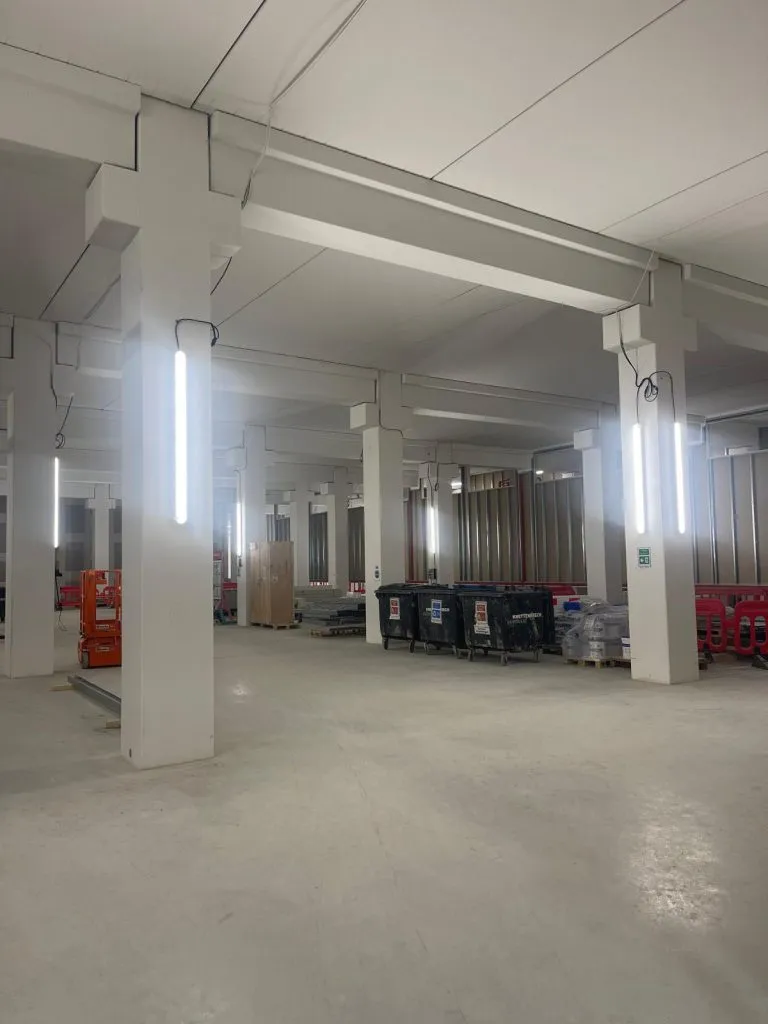 Temporary site lighting across an empty building level