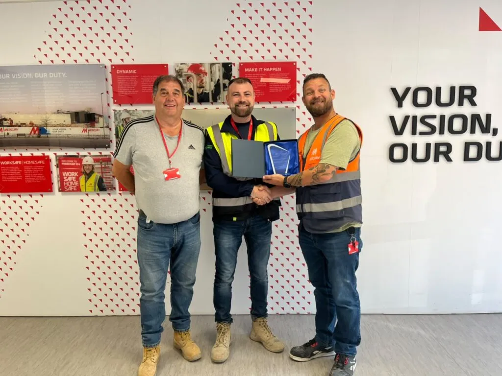 Paul Haigh, EHS Manager, and David (Dee) Henry, Construction Manager, collecting the Safety Contractor of the Month award for SA3 POWER