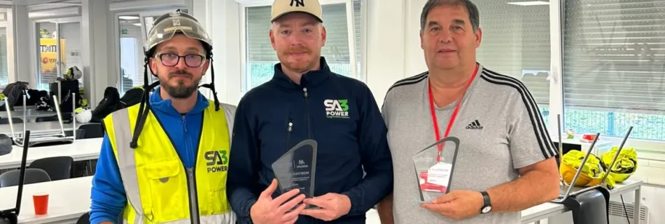 SA3 POWER team members holding Safety and Quality Trade Partner League monthly awards