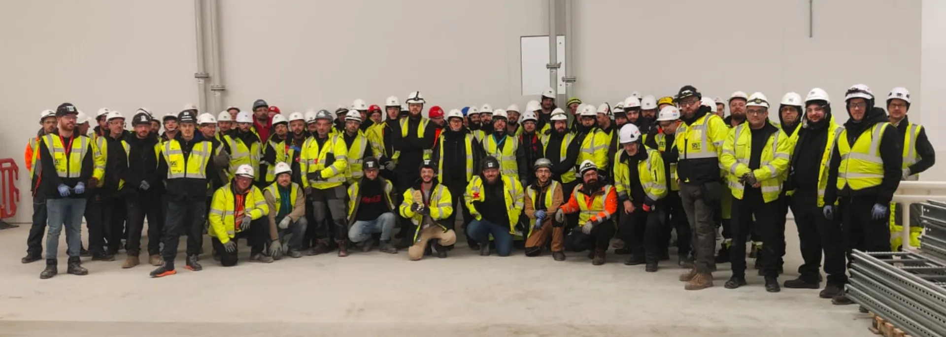 The SA3 Power site team gathered inside a data centre under construction